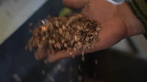 Copper Recycling Separation - Hand Holding Pure Copper Pieces Slow Motion Stock Footage 330493982