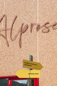 Copper Script Sign Across Warm Textured Wall, Elegant Handwritten Word Disp.. Stock Photos