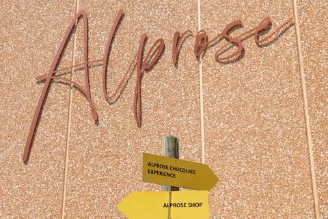 Copper Script Sign Across Warm Textured Wall, Elegant Handwritten Word Disp.. Stock Photos