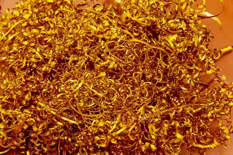 Copper shavings. Copper processing on CNC machines in production. Stock Photos