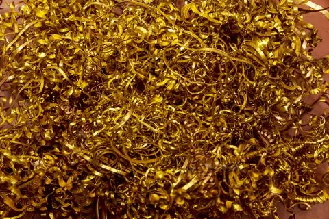 Copper shavings. Processing of copper parts on CNC machines. Stock Photos