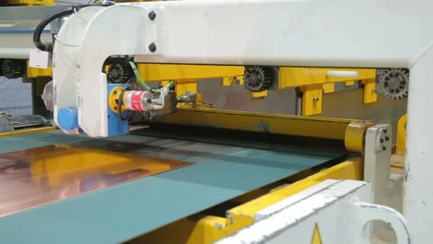 Copper sheet is fed into the machine Stock-Footage 103847084