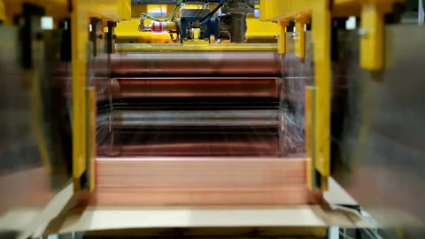 Copper sheets are fed to the package after cutting Stock Footage 103847270