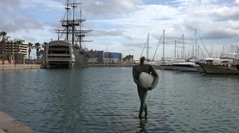 Copper statue of Icarus Returns and Spanish Galleon Stock Footage 44345212