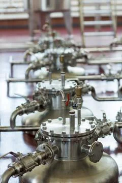 Copper still alembic inside distillery to distill grapes and produce spirits Stock Photos
