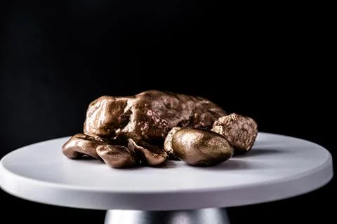 Copper stone on electronic scale. Metal used in industry. Mineral extraction  Stock Photos
