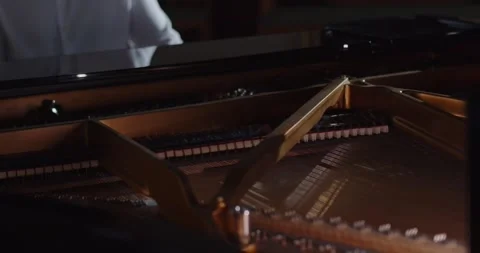 Copper strings inside a piano. Close up Stock Footage 280404828