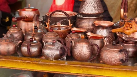 Copper Teapots and Kettles Displayed at Market — Artisanal Metal Craft Stock Footage 312584807