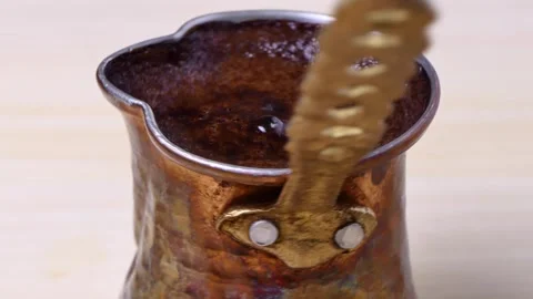 Copper Turkish coffee pot rotate on a board Video stock 248366941