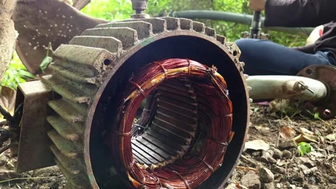 Copper Winding Insulated Coils exposed inside an open electric induction motor c 動画素材 344791555