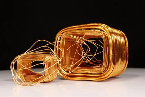 Copper windings different sizes from electric current transformers Stock Photos