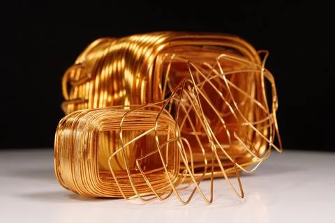 Copper windings different sizes from electric current transformers 库存照片