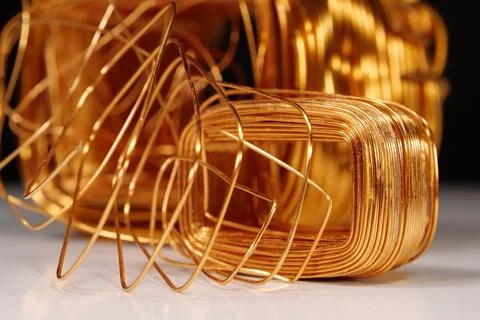 Copper windings different sizes from electric current transformers Stock Photos