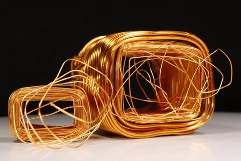 Copper windings different sizes from electric current transformers Stock Photos