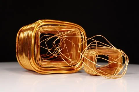 Copper windings different sizes from electric current transformers Stock Photos