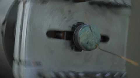 Copper Wire is Attached to the Rotating Machine. Spinning Motion at Production Stock Footage 197344383