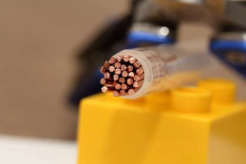 Copper wire in a dense insulating braid Stock Photos