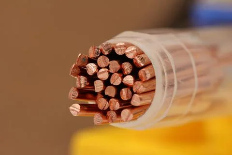 Copper wire in a dense insulating braid Stock Photos