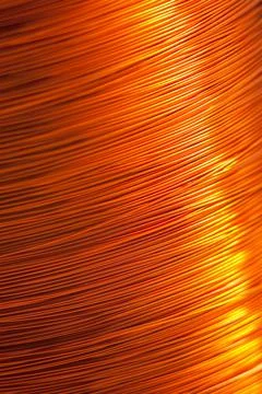 Copper wire for electronics close-up with a focus on the center and blurred Stock Photos