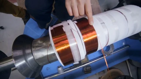 Copper wire forming machine. Modern industrial equipment for transformer Stock Footage 71290654