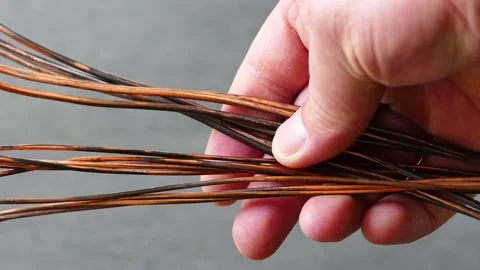Copper wire inside electrical wiring-an electrician has copper wire in his ha Stock Footage 170625632