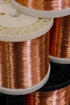 Copper wire on large plastic spools Stock Photos