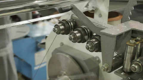Copper wire passes through winding machine. Production of transformers, electric Stock Footage 205226054