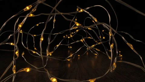 Copper Wire String Lights On A Wooden Surface Stock Footage 278598635