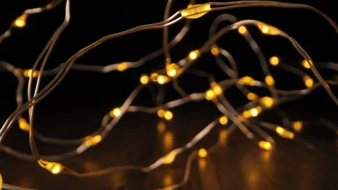 Copper Wire String Lights On A Wooden Surface Stock Footage 279071272