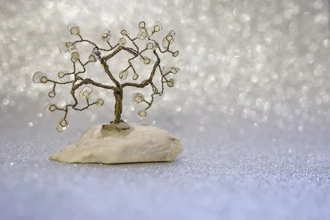 Copper wire tree on silver glitter  background, close up with bubble bokeh Stock Photos