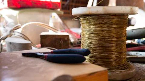 Copper wire winding in workshop Foto stock