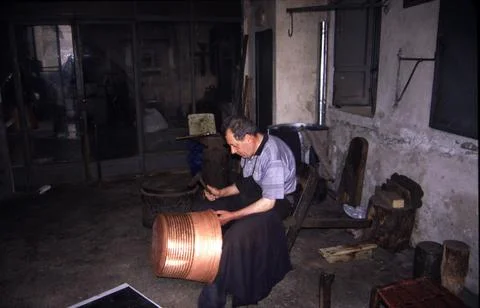 Coppersmith at work in his workshop. Stock Photos