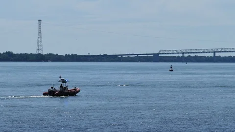 Cops boat with lights and a bridge Stock Footage 116103341