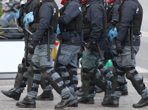 Cops with divided with blackjack and blackjack during the riot Stock Photos