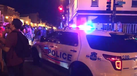 Cops guard and protect a Black Lives Matter protest rally in Washington, DC Stock Footage 64926776