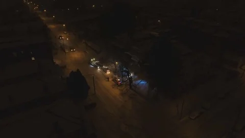 Cops help tow truck taking car off snow road Vídeos de archivo 74144615