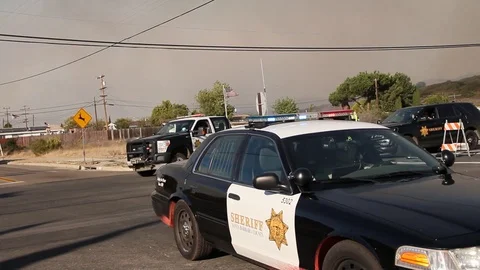 Cops leave scene of fire Stock Footage 114415572