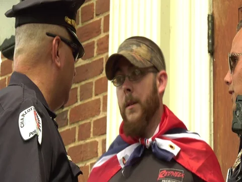 Cops question a Confederate flag supporter Video stock 77960677