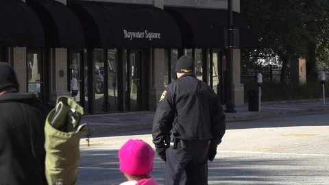 Cops in slow motion looking at crowd Stock Footage 128445736