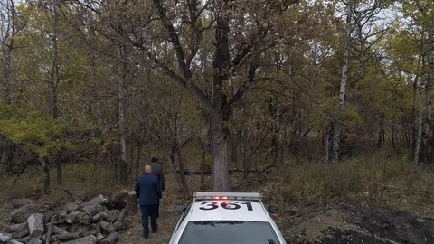 Cops walk onto a crime scene back view Stock-Footage 120610654