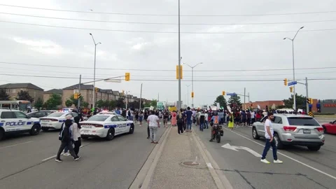 Cops will need to backup if they don't want to get assaulted by BLM protesters Stock Footage 133975309