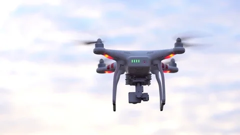 Copter drone Phantom flies at clouds Stock Footage