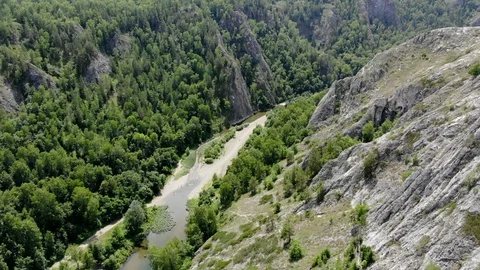Copter flies along the river. Between the rocks. Stock Footage 129508980