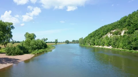 The copter flies low above the surface of the water Stock Footage 119076106