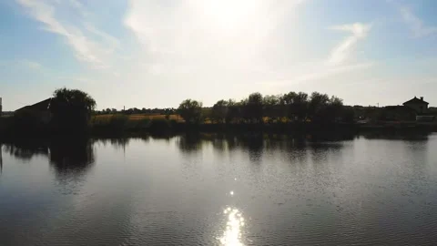 The copter flies low over the water. the drone flies over the river, in morning Stock Footage 201805370