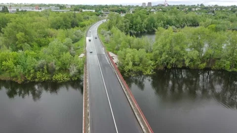 Copter flies over the bridge over the river Stock Footage 151252864