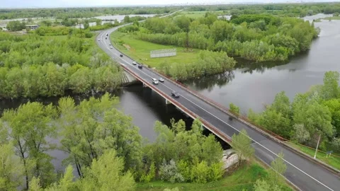 Copter flies over the bridge over the river Stock Footage 151252867