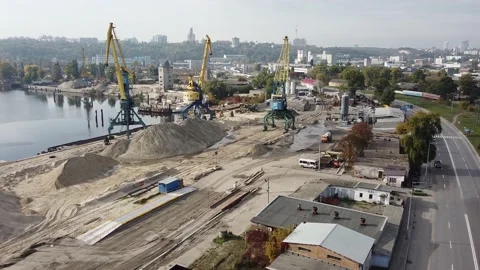 Copter flies over cargo cranes. sand quarry. heaps of sand. Stock Footage 141897184