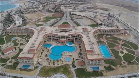 A copter flies over an empty hotel in Egypt Stock Footage 126732672