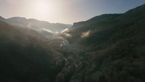 The Copter Flies Over the Gorge at the Bottom Flows the River in Front of Vídeos de archivo 69173317